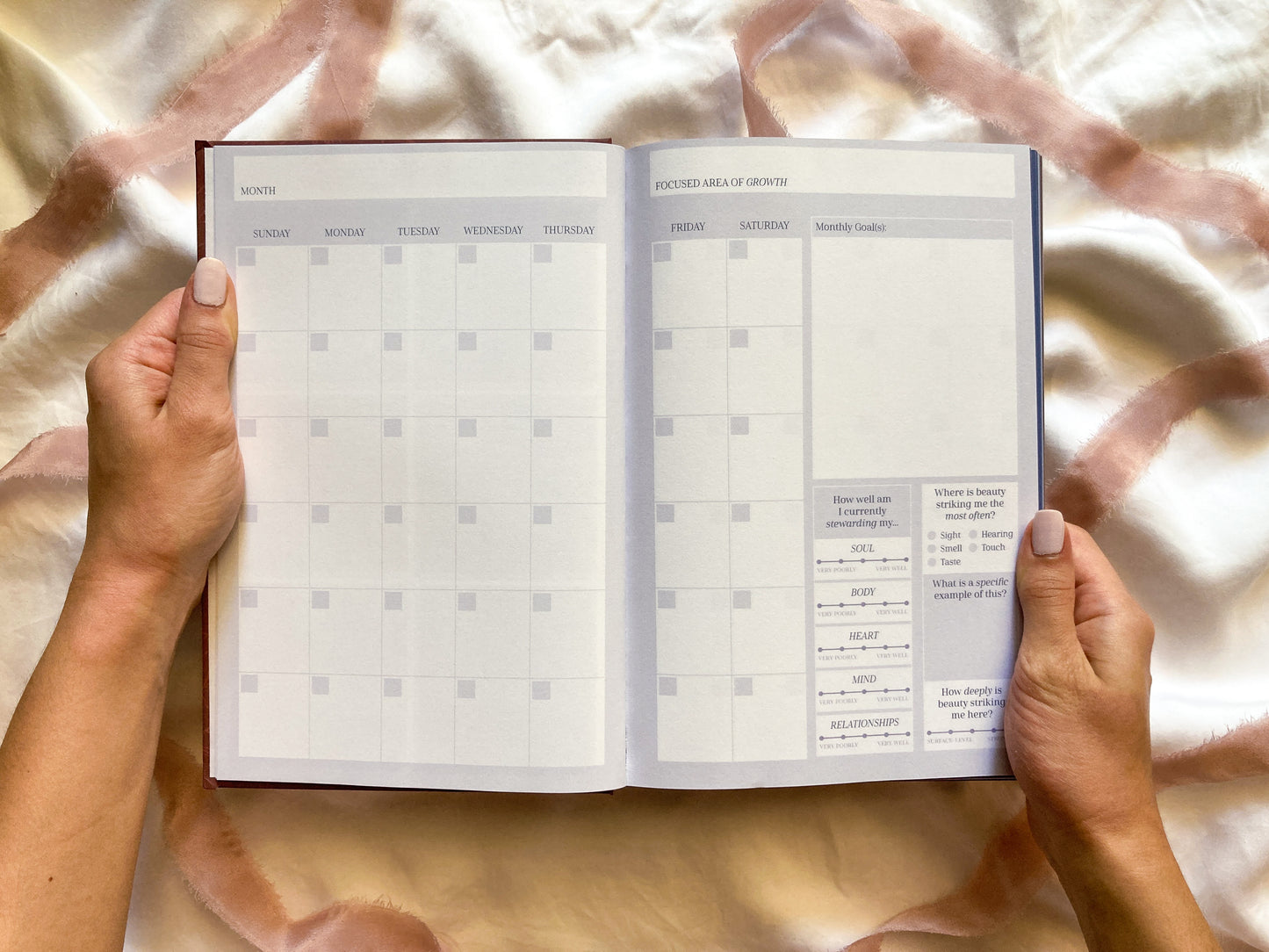 Image of Reawaken Planner monthly spread. Spaces to plan your month, a space to make monthly goals, & a space to check-in with your encounters with beauty.